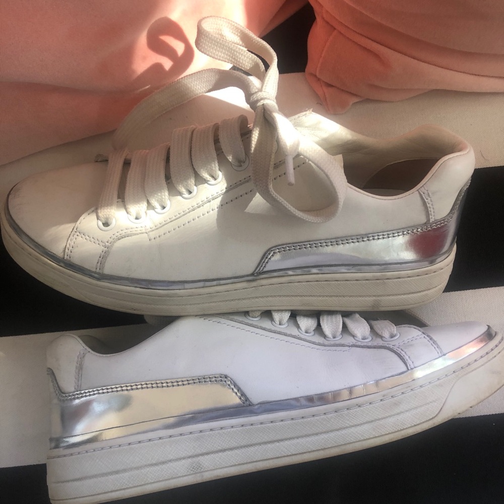 White Prada sneakers with silver heel detail
